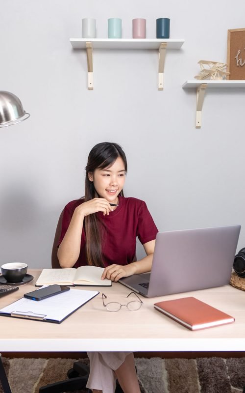 young-beautiful-asian-woman-working-home